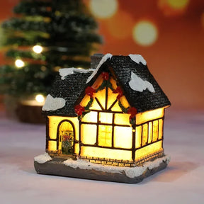Casette di Natale in miniatura decorate con luci LED.