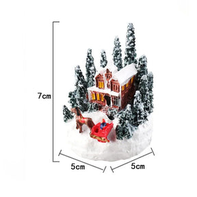 Casette di Natale in miniatura decorate con luci LED.