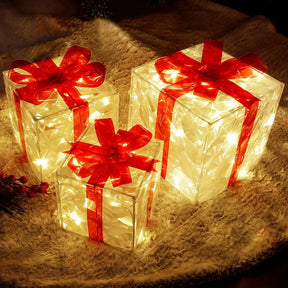 Tre set di scatole regalo decorative illuminate