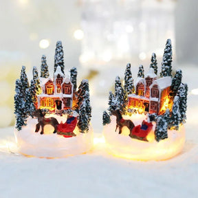Casette di Natale in miniatura decorate con luci LED.