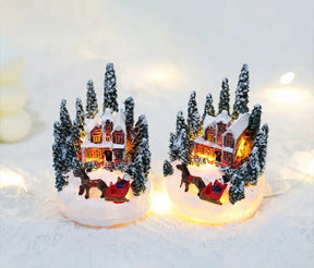 Casette di Natale in miniatura decorate con luci LED.
