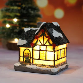 Casette di Natale in miniatura decorate con luci LED.